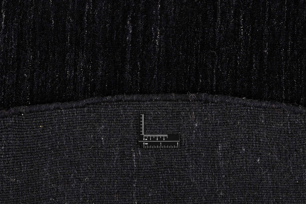 Tapis Rond 100% Laine Noir - Filato, gros plan sur la texture