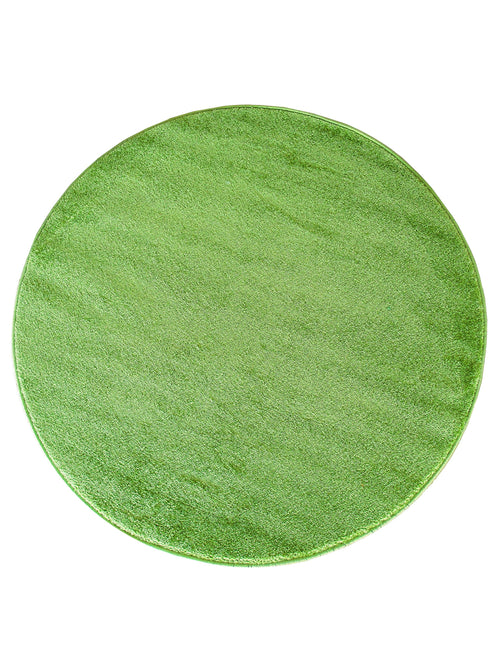 Tapis circulaire d'un vert vif et lumineux, avec une texture dense et moelleuse