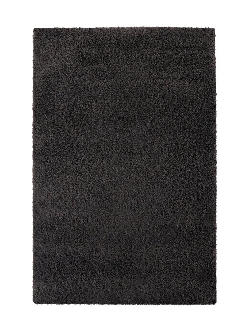 Tapis rectangulaire gris anthracite à poils longs et texture moelleuse, posé sur un fond blanc pur