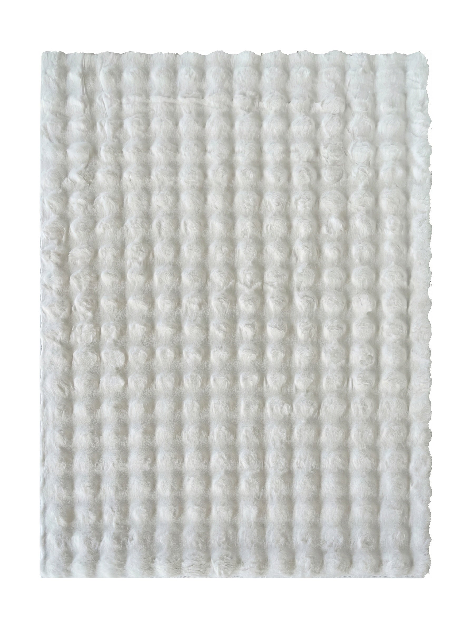 Tapis blanc à poils longs et doux, avec un motif régulier de ronds en relief