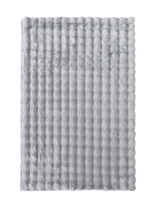 Tapis gris clair et duveteux, orné d'un motif texturé de rangées de formes arrondies et moelleuses