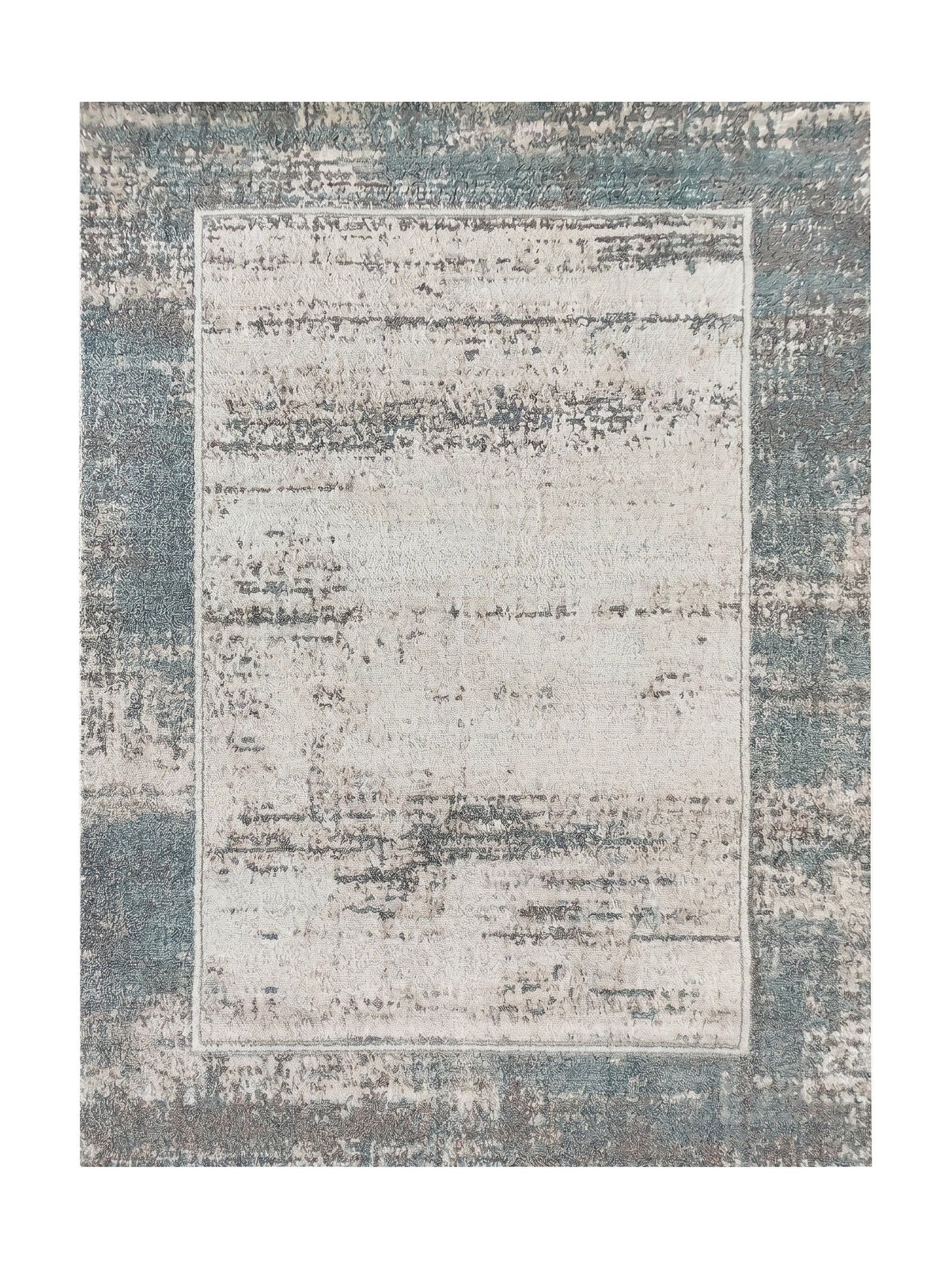 Tapis rectangulaire aux motifs abstraits, avec un centre clair crème et gris et une bordure plus foncée bleu-vert et grise, effet usé