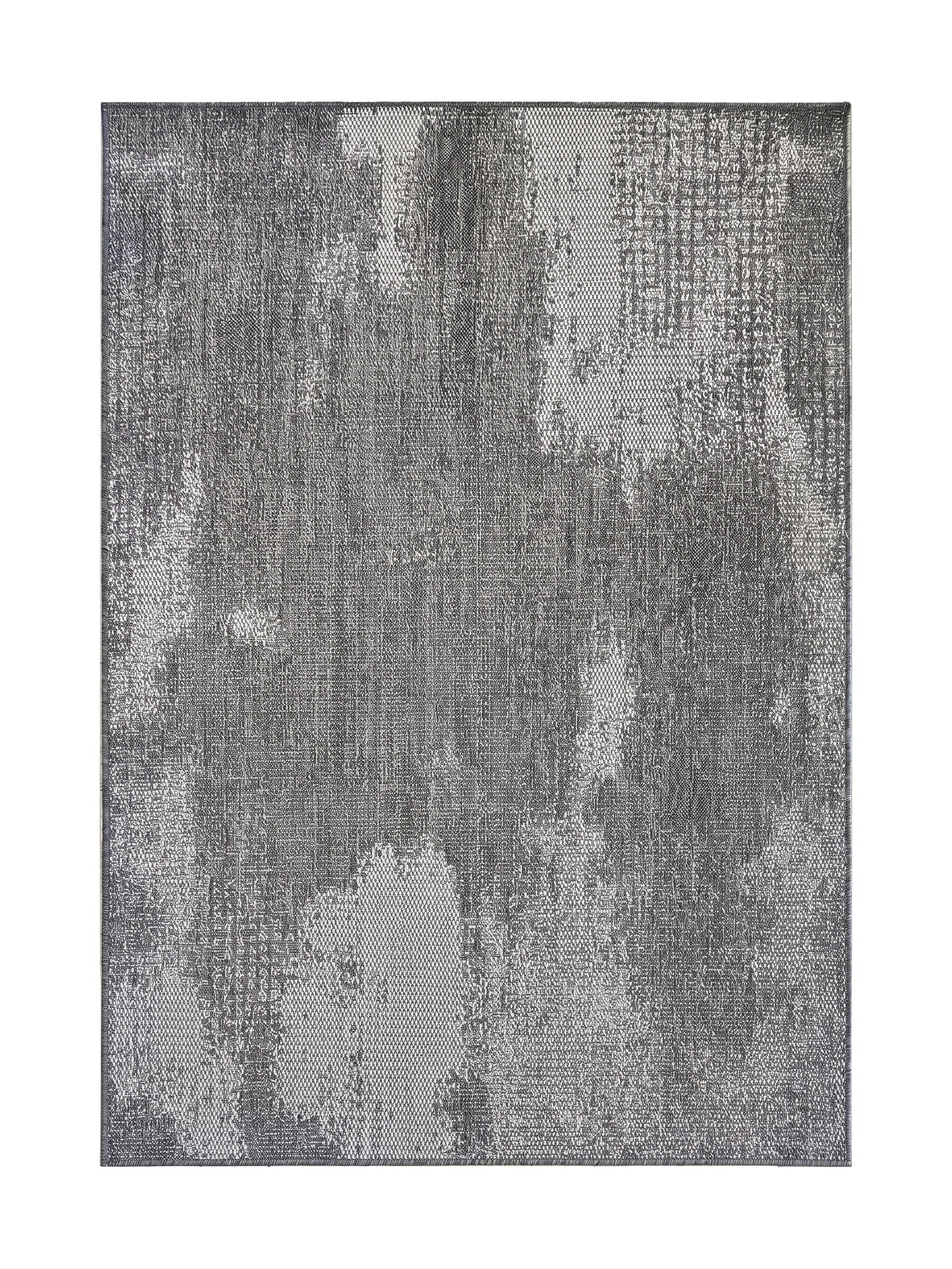 Tapis rectangulaire tissé gris avec des motifs abstraits et irréguliers gris clair, donnant un aspect délavé